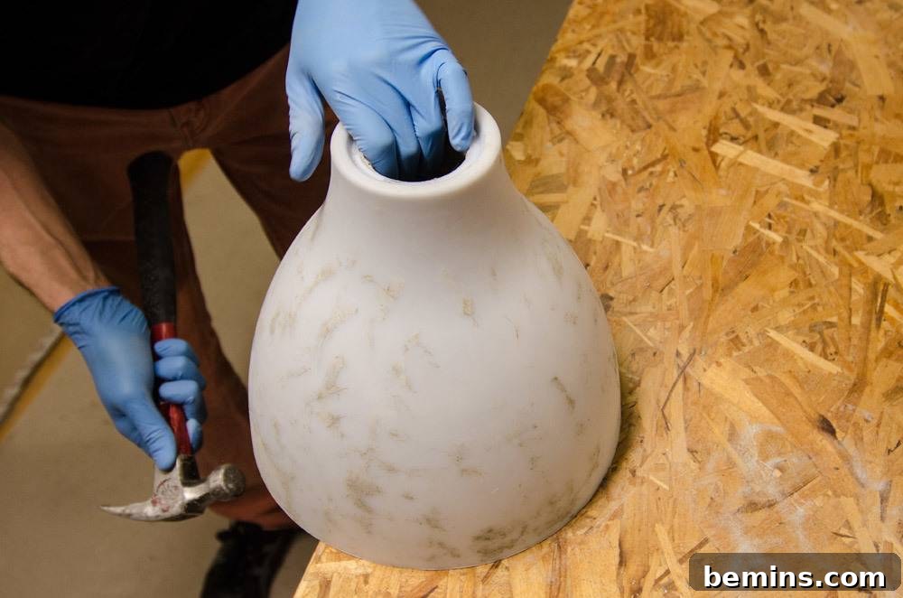 IKEA Upgrade: Crafting a Chic Concrete Pendant Light 12 Tapping the mold to release the concrete pendant