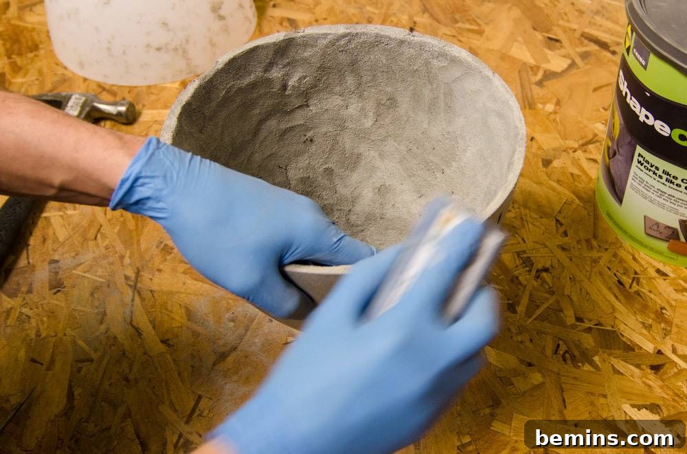 IKEA Upgrade: Crafting a Chic Concrete Pendant Light 16 Sanding the concrete edges