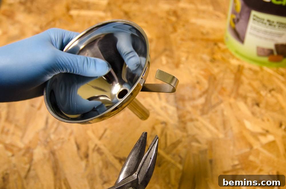 IKEA Upgrade: Crafting a Chic Concrete Pendant Light 17 Removing the handle from the metal funnel