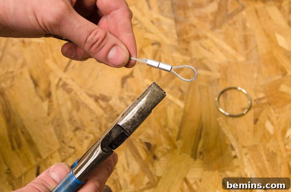 IKEA Upgrade: Crafting a Chic Concrete Pendant Light 28 Using a tool on a wire
