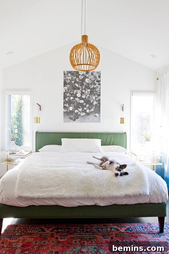 Bedroom featuring pastel pink walls and modern furniture
