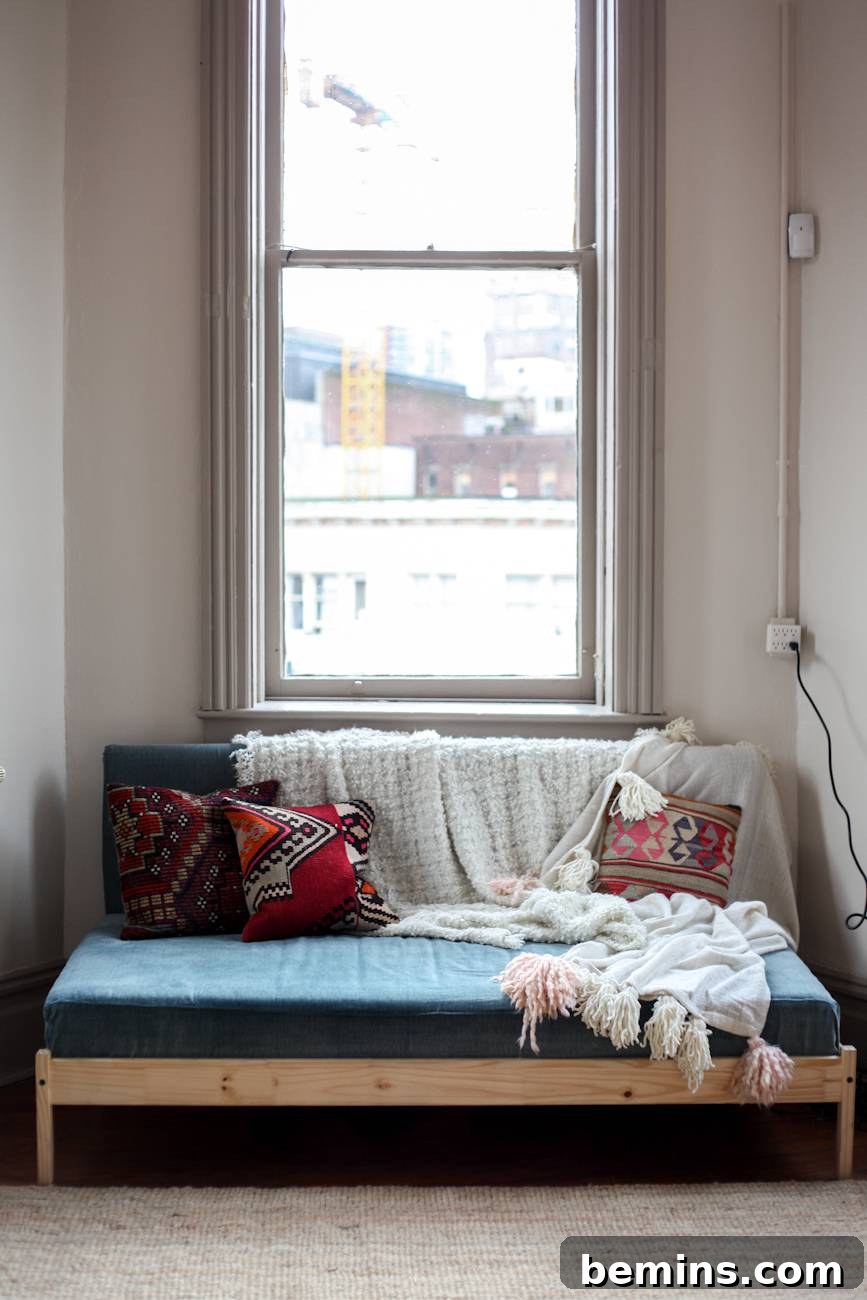 FJELLSE Bedframe to Chic Couch: An IKEA Hack 3 Sitting area with a couch made from an IKEA bed frame.