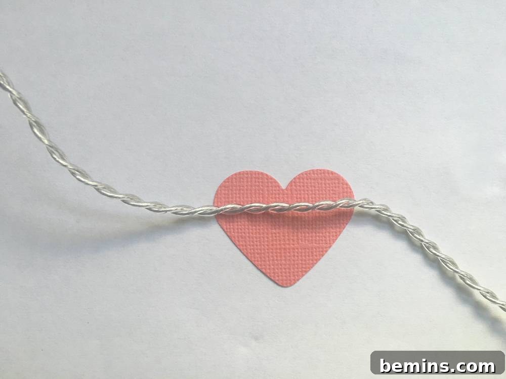 Attaching heart shapes to string lights