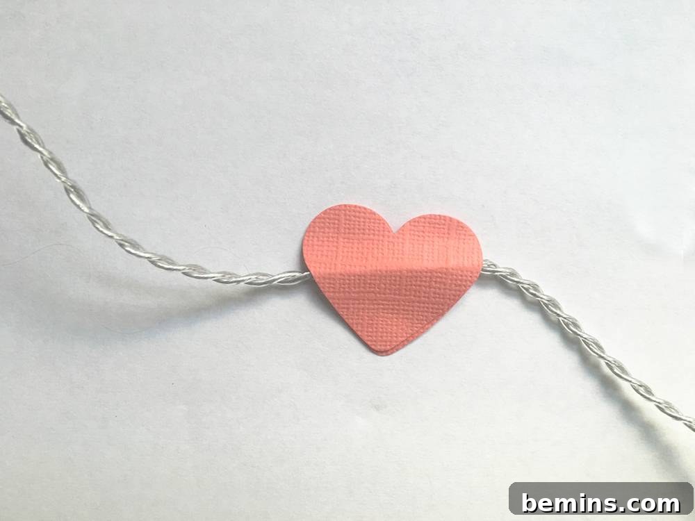 Using hot glue to attach hearts