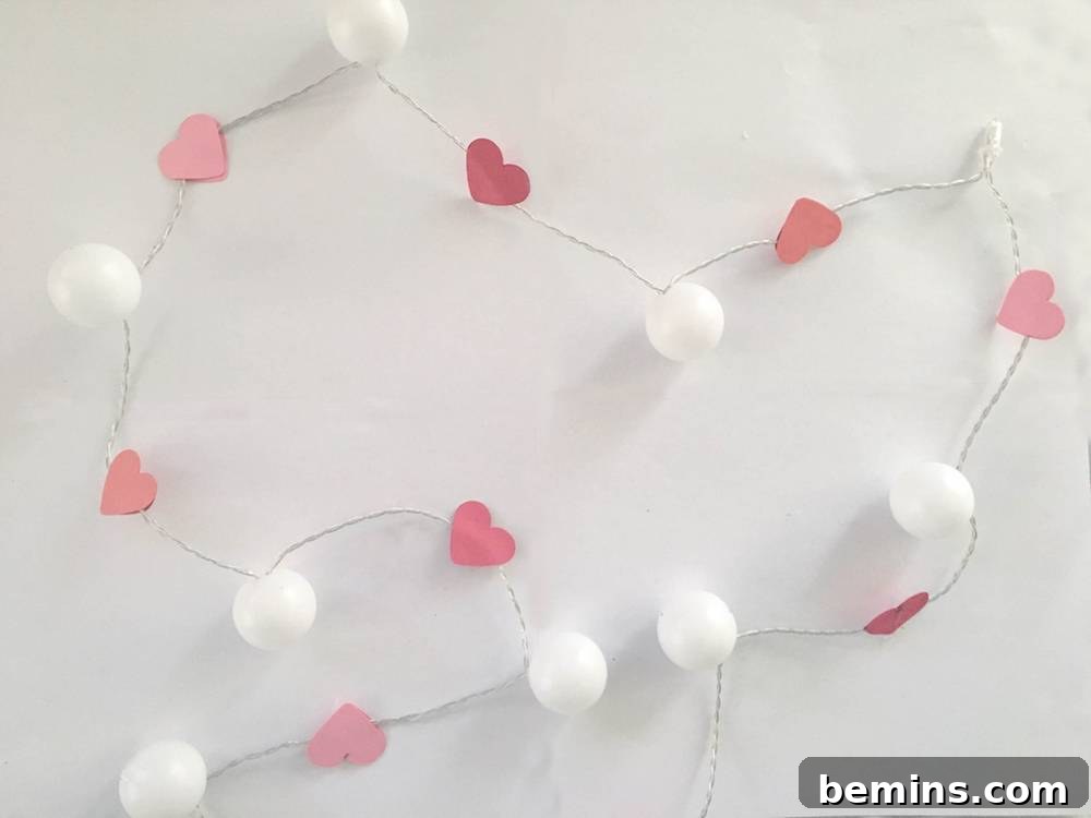 Inserting bulbs into ping pong balls