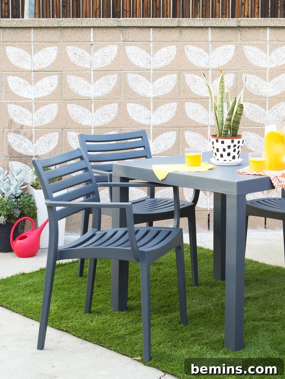 Patio with a spring vibe featuring a chalk-patterned brick wall