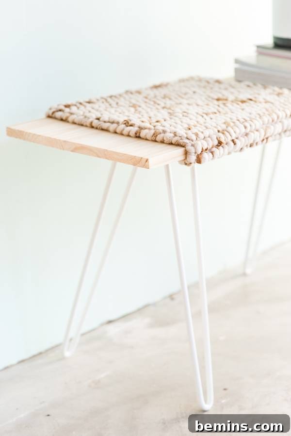 7 Creative DIY Projects to Tackle This Weekend 5 A minimalist wooden bench with a cloth mat on top, showcasing a quick and budget-friendly seating solution for any room.