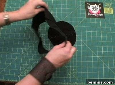 Black leather being prepared for the tricorn hat.
