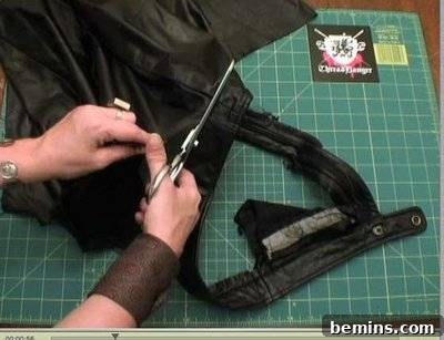 Black leather being pinned together for stability.