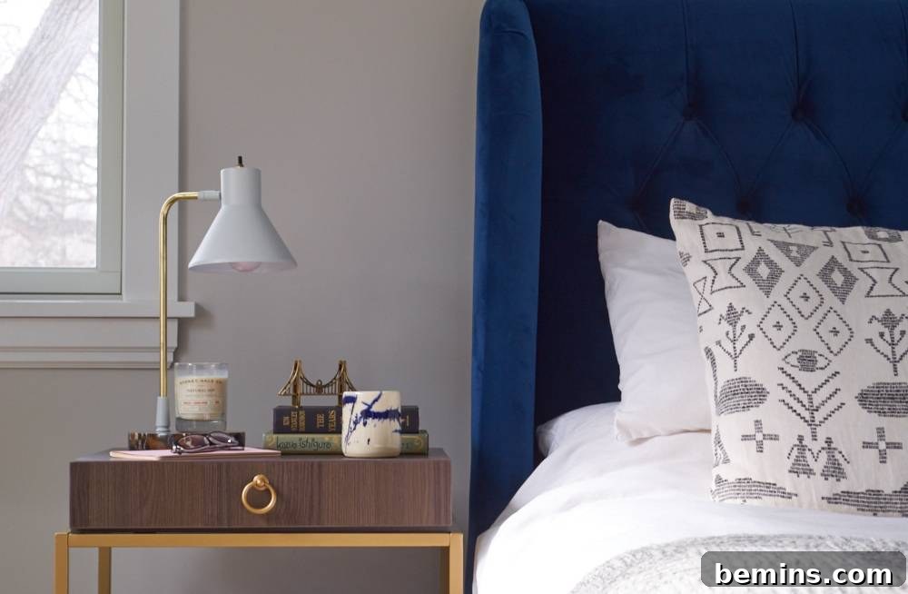 Bedroom decor with white bedding and a blue throw