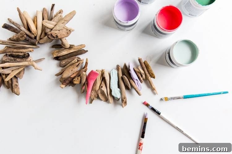 Driftwood Dreams: Crafting a Coastal Hanging Mobile 5 Arranging Painted Driftwood