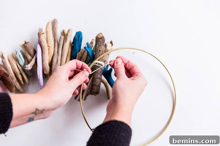 Driftwood Dreams: Crafting a Coastal Hanging Mobile 7 Attaching Driftwood Strands to Metal Hoop