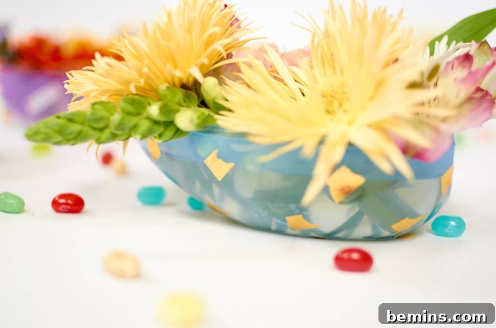 Flowers arranged in a blue, boat-like container.