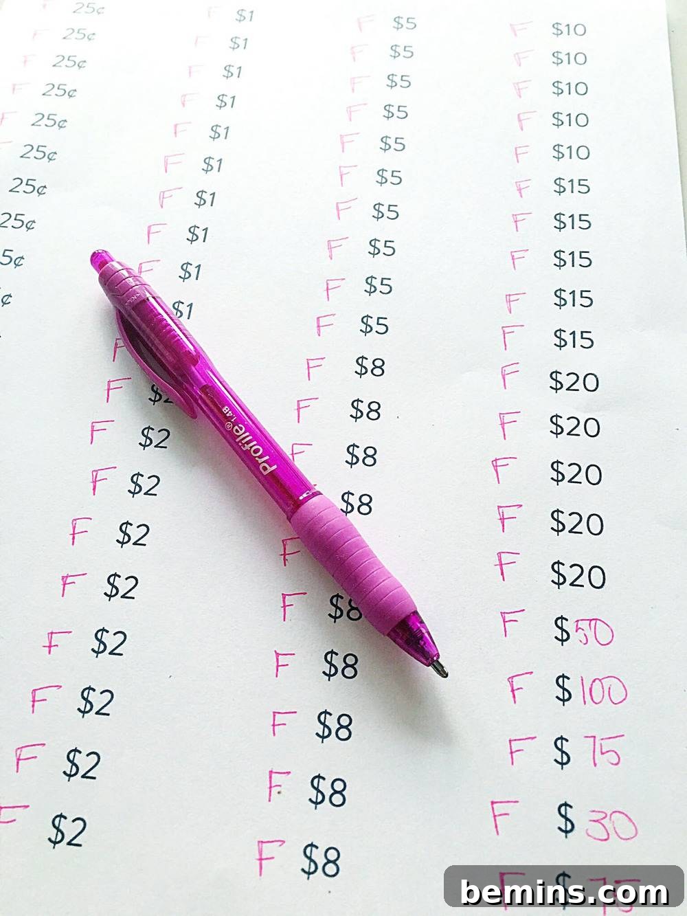 Close-up of a pen marking answers on a paper