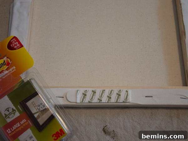 Attach a Command Picture Hanger on the bottom of the mail organizer