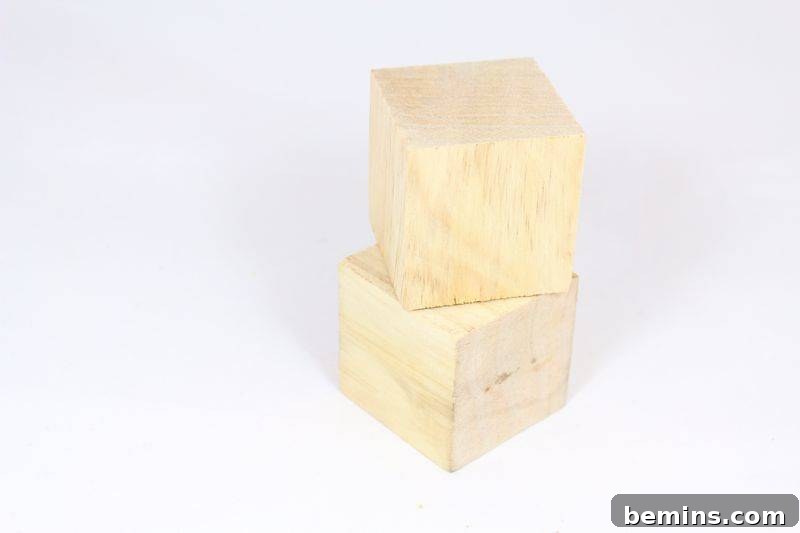 A plain, light-colored wood block is set ready for the DIY Scrabble planter project.