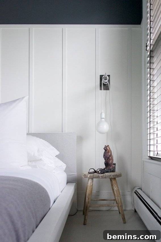 10 Stunning DIY Lighting Ideas No Electrician Required 5 A stylish plug-in wall sconce providing warm ambient light, mounted on a wall without visible wiring.
