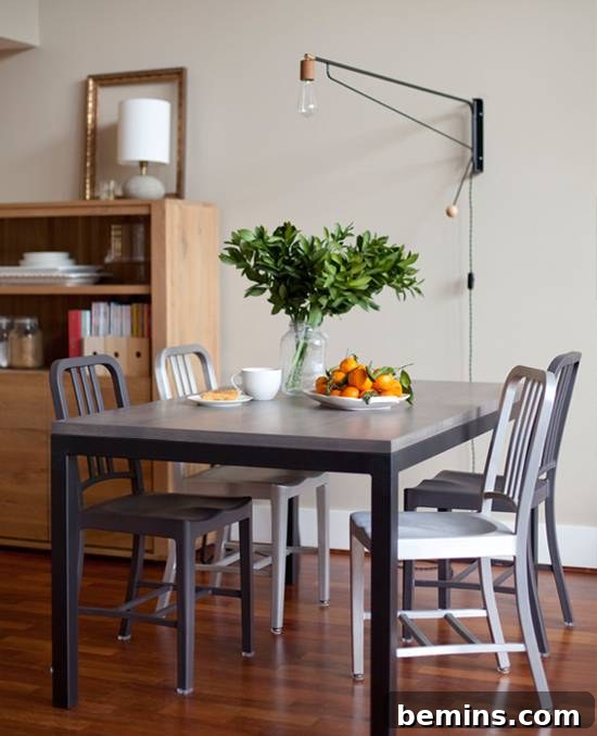 10 Stunning DIY Lighting Ideas No Electrician Required 7 A dining room illuminated by market lights strung elegantly across the ceiling, creating a warm and inviting atmosphere.