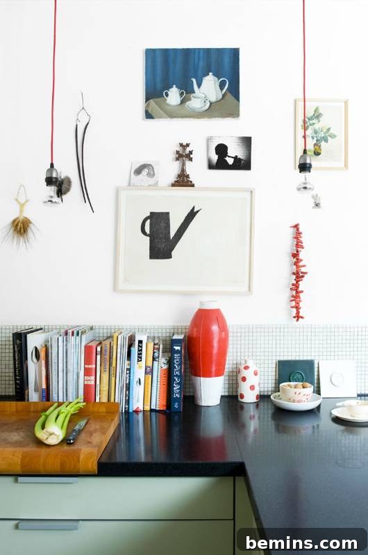 Cookbooks covering a backsplash in a rental kitchen