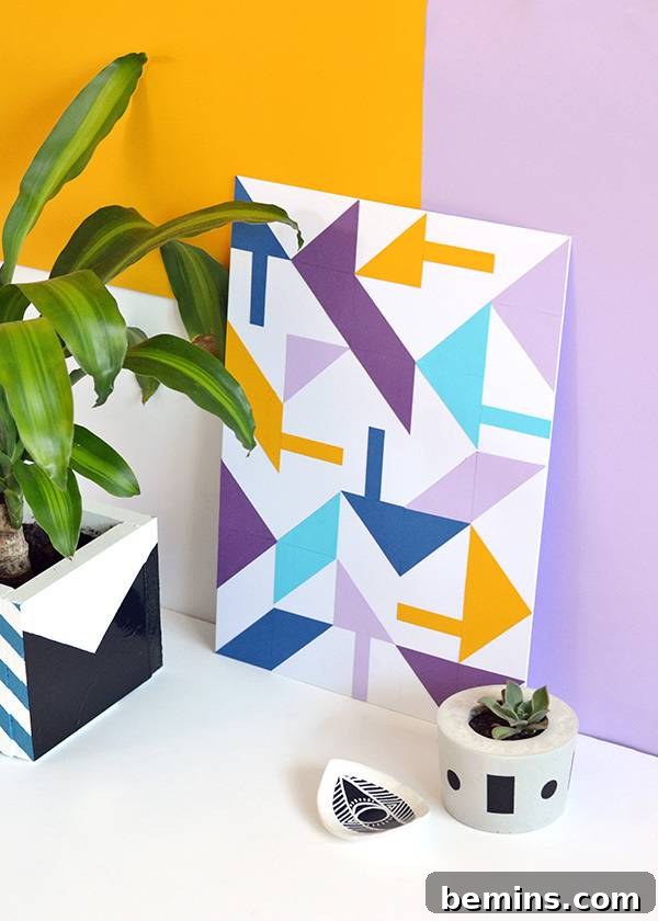 Close-up of DIY geometric paper wall art showcasing intricate paper triangles and strips arranged on a grid