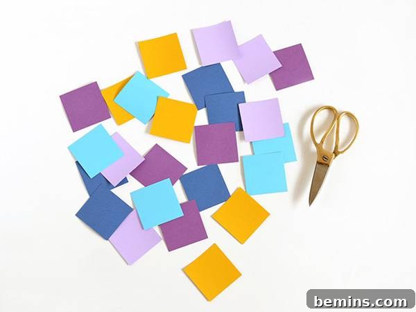 Various colored squares precisely cut from different paper types, ready for shaping