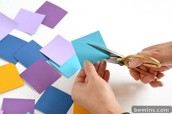 A colored square being measured diagonally for cutting into two triangles