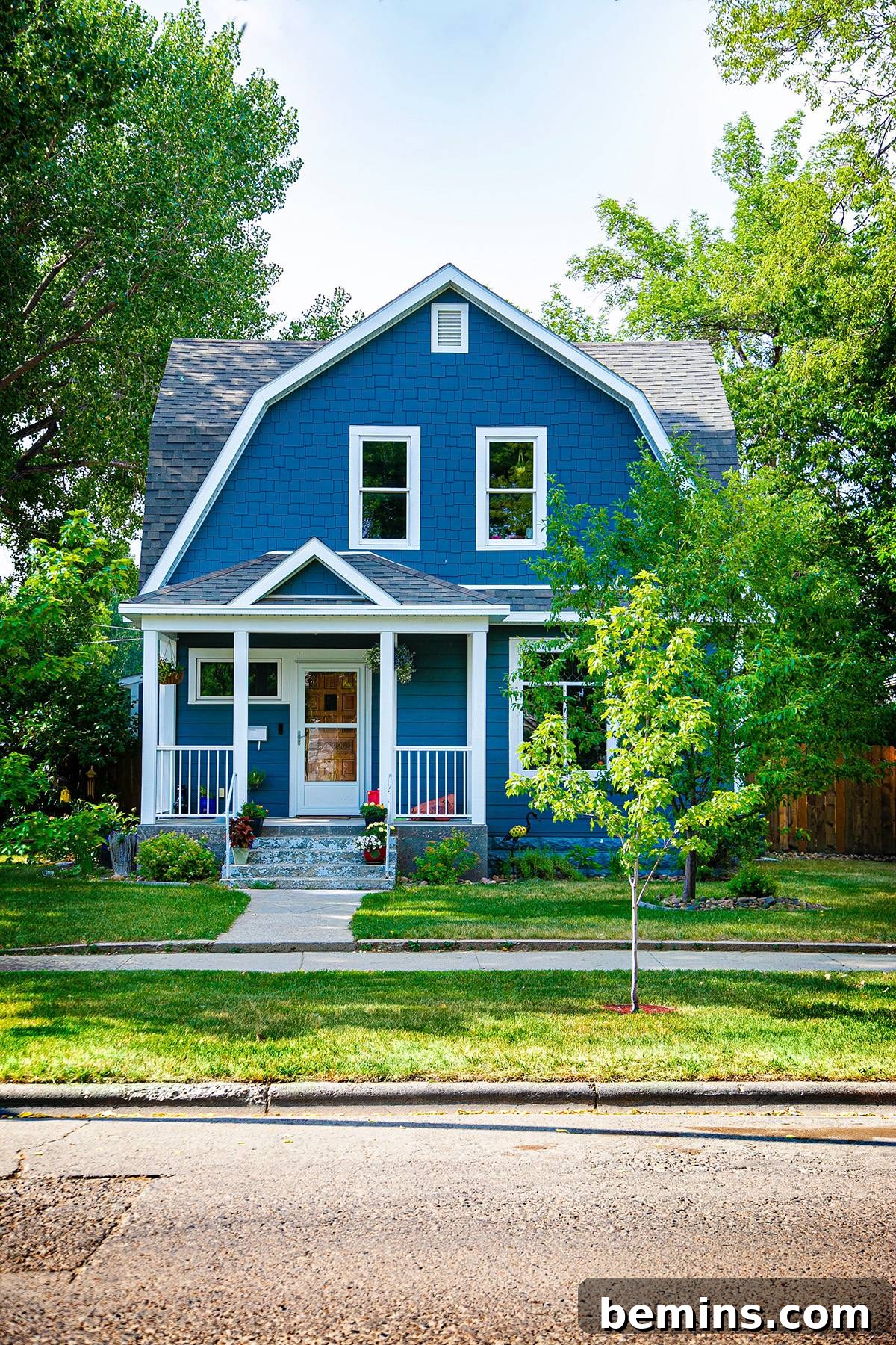 Beautiful house front in spring with a well-maintained lawn