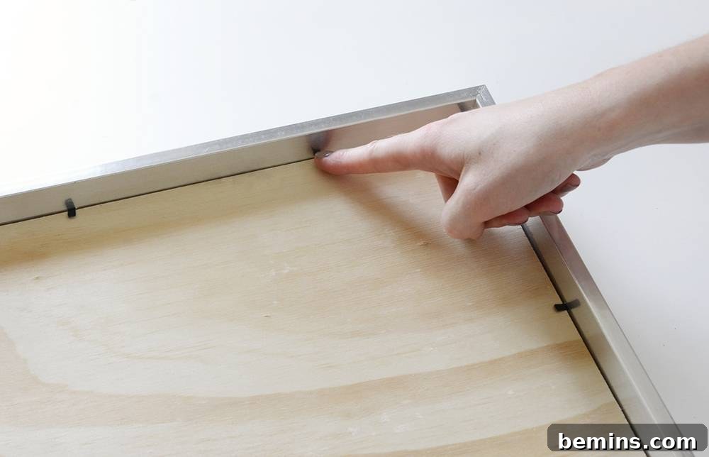 Inserting stained wood into frame