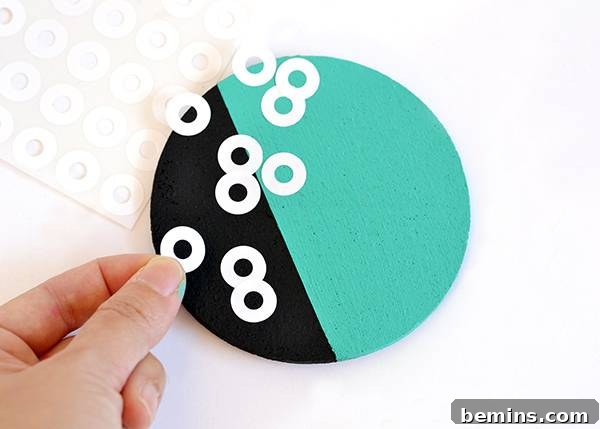 Patterned Cork Coasters: Elevating Your Drink Experience 12 Applying hole reinforcement stickers to the coaster
