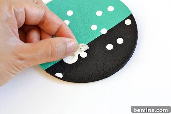 Patterned Cork Coasters: Elevating Your Drink Experience 14 Removing the stickers to reveal the polka dot pattern