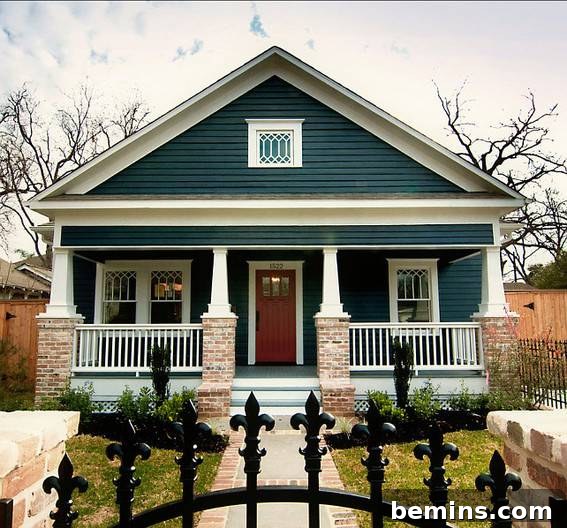 Dark Teal Craftsman Home with White Trim