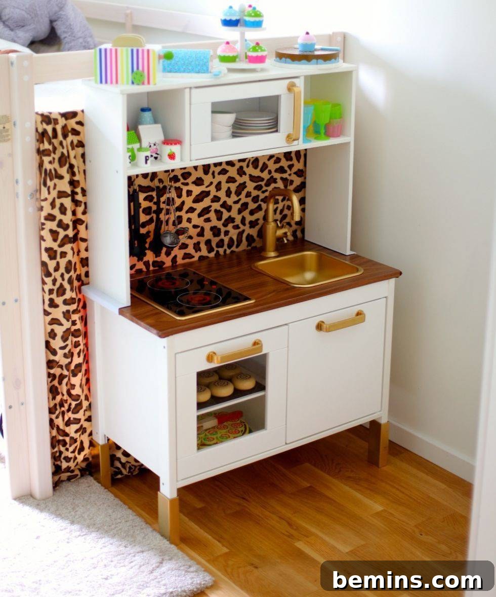 10 Clever IKEA Play Kitchen Transformations for Little Chefs 10 Glamorous IKEA Duktig play kitchen featuring gold spray paint accents and playful leopard print fabric.