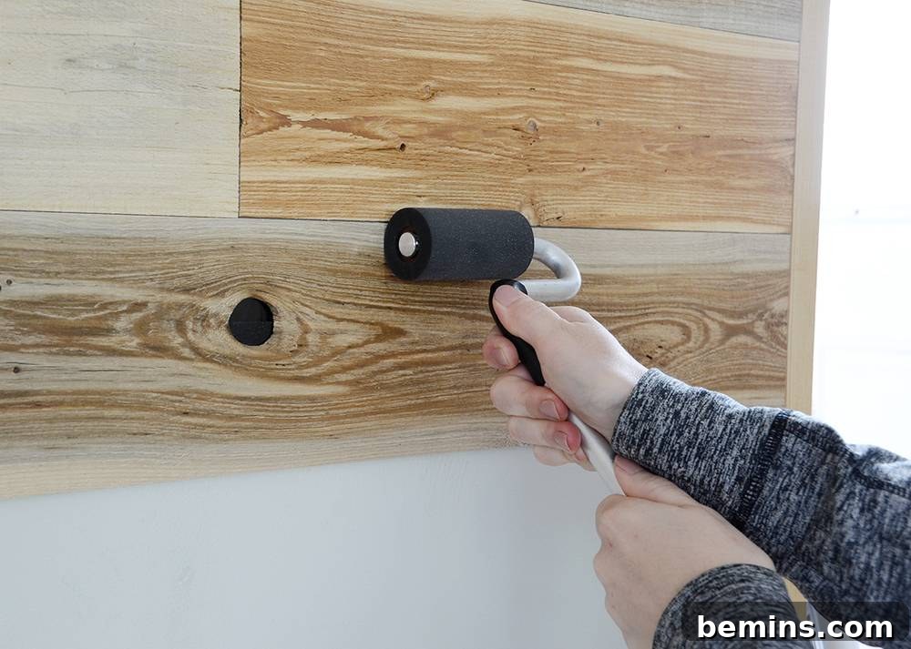 Securing the Reclaimed Wood Planks to the Wall