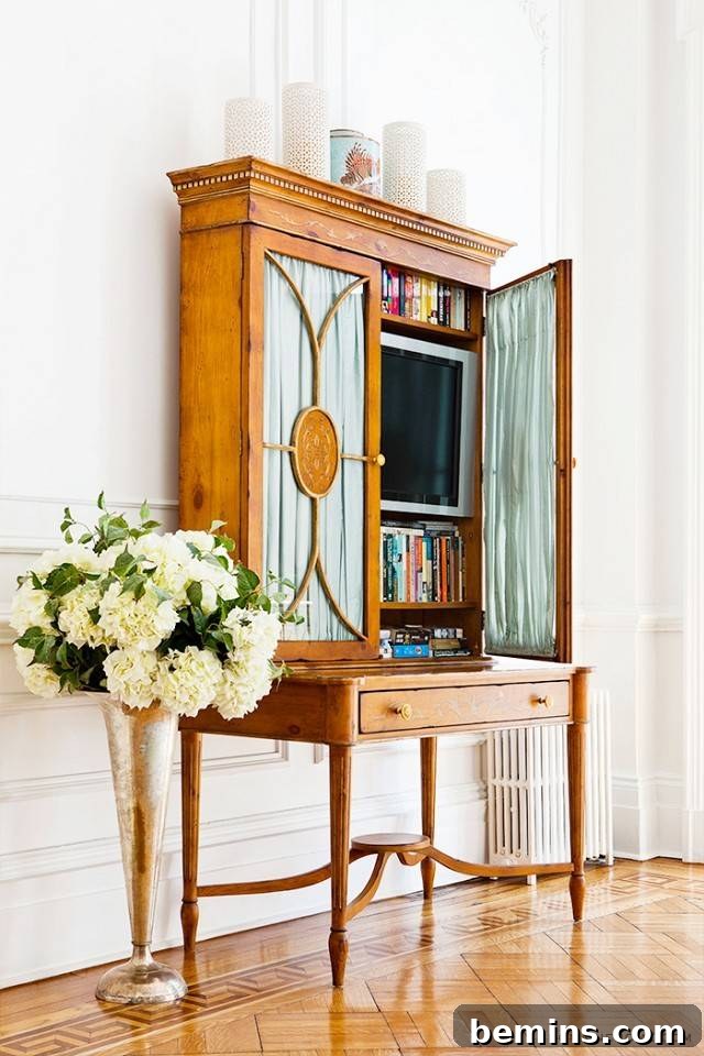 Secretary-style desk used to hide a TV in a traditional or eclectic interior