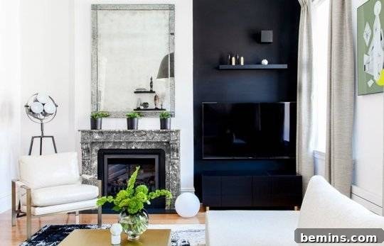 Black accent wall camouflaging a TV and stereo equipment for a sleek look