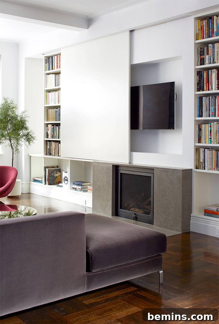 Modern living room with a large sliding door concealing a wall-mounted TV