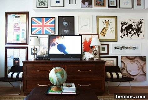 Colorful and eclectic gallery wall integrating a TV seamlessly
