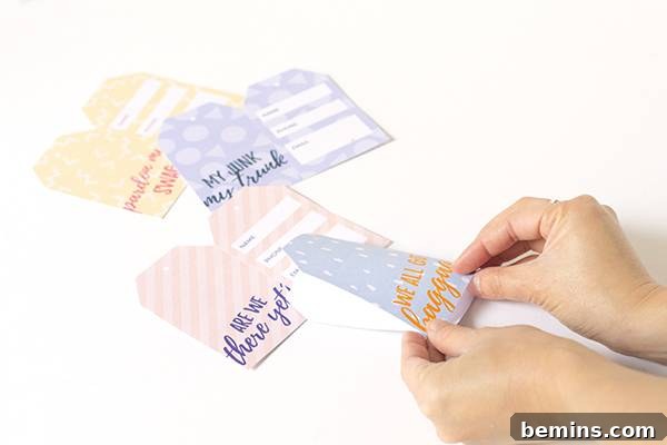 Printable cheeky luggage tags showing folding the tag