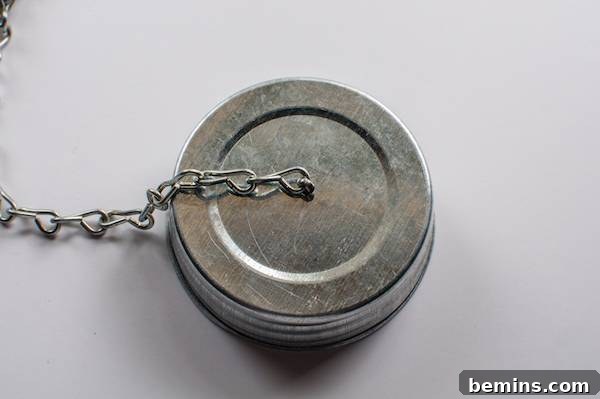 How to Craft a Hanging Air Plant Terrarium from a Mason Jar 4 Attaching the Chain to the Lid