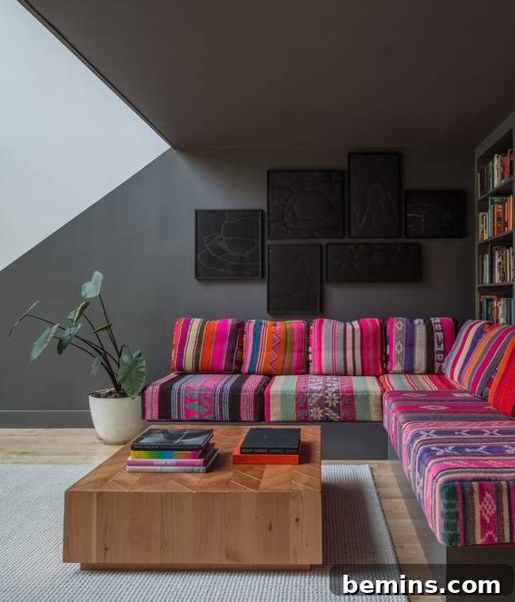 Our Top Picks: Southwestern Fabrics and Designs 4 Southwest Interior Design: A modern sofa featuring eighteen different Peruvian blankets, creating a unique and colorful statement piece.