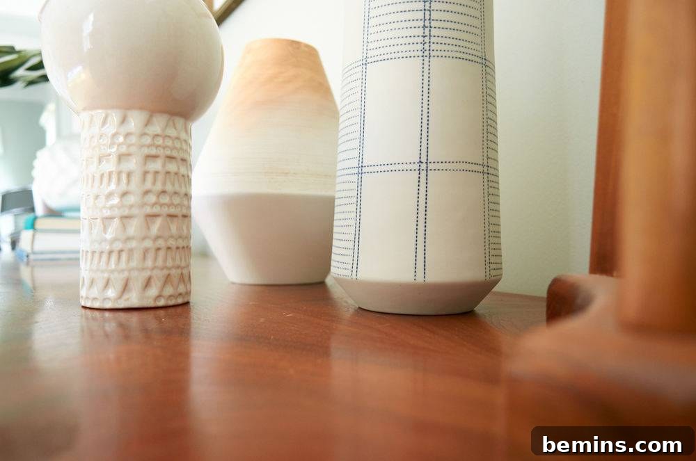 White colored decorative pieces on the wooden table.