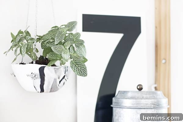 Create Beautiful DIY Hanging Clay Planters 15 Close-up of a DIY polymer clay hanging planter