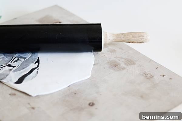 Create Beautiful DIY Hanging Clay Planters 4 Rolling out polymer clay for a DIY planter