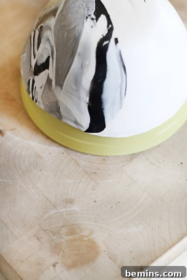 Create Beautiful DIY Hanging Clay Planters 6 Cutting and draping clay over an oven-safe bowl for shaping