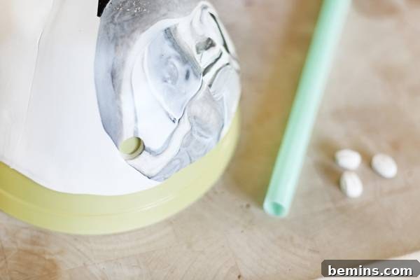 Create Beautiful DIY Hanging Clay Planters 7 Using a straw to make holes in polymer clay for hanging