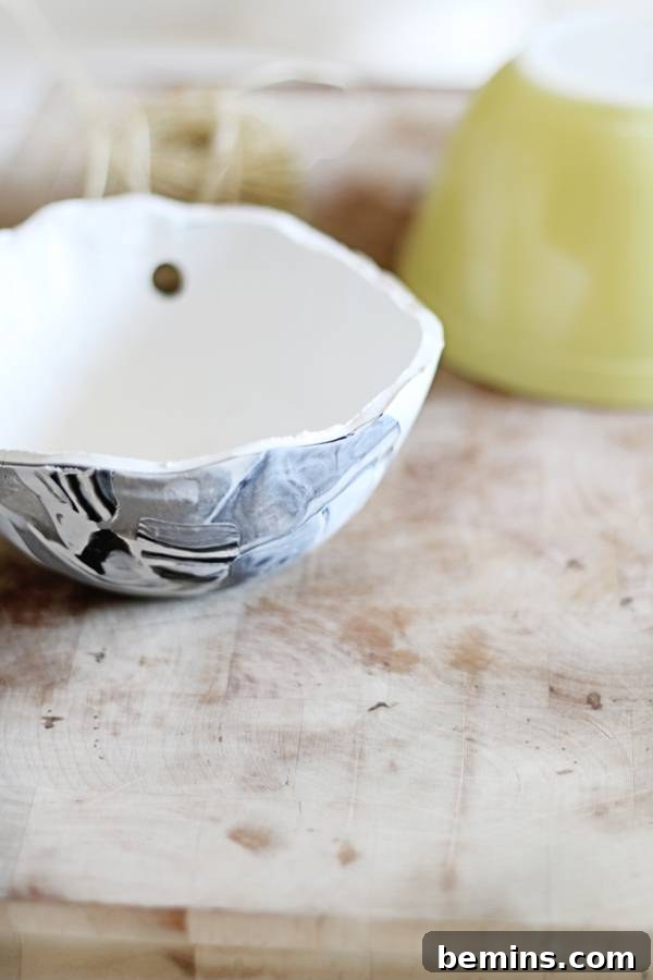 Create Beautiful DIY Hanging Clay Planters 8 Baking and cooling the polymer clay planter on an oven-safe bowl