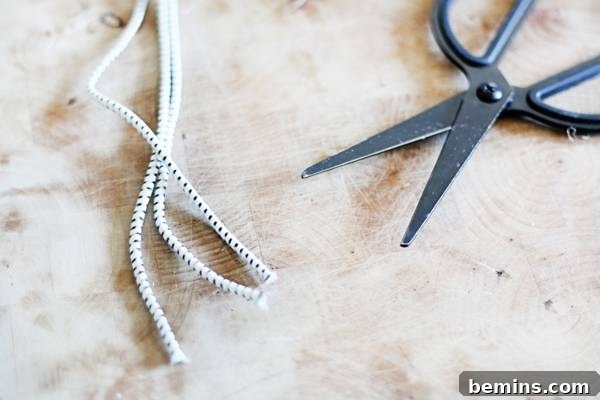 Create Beautiful DIY Hanging Clay Planters 9 Cutting three strands of cord for the hanging planter