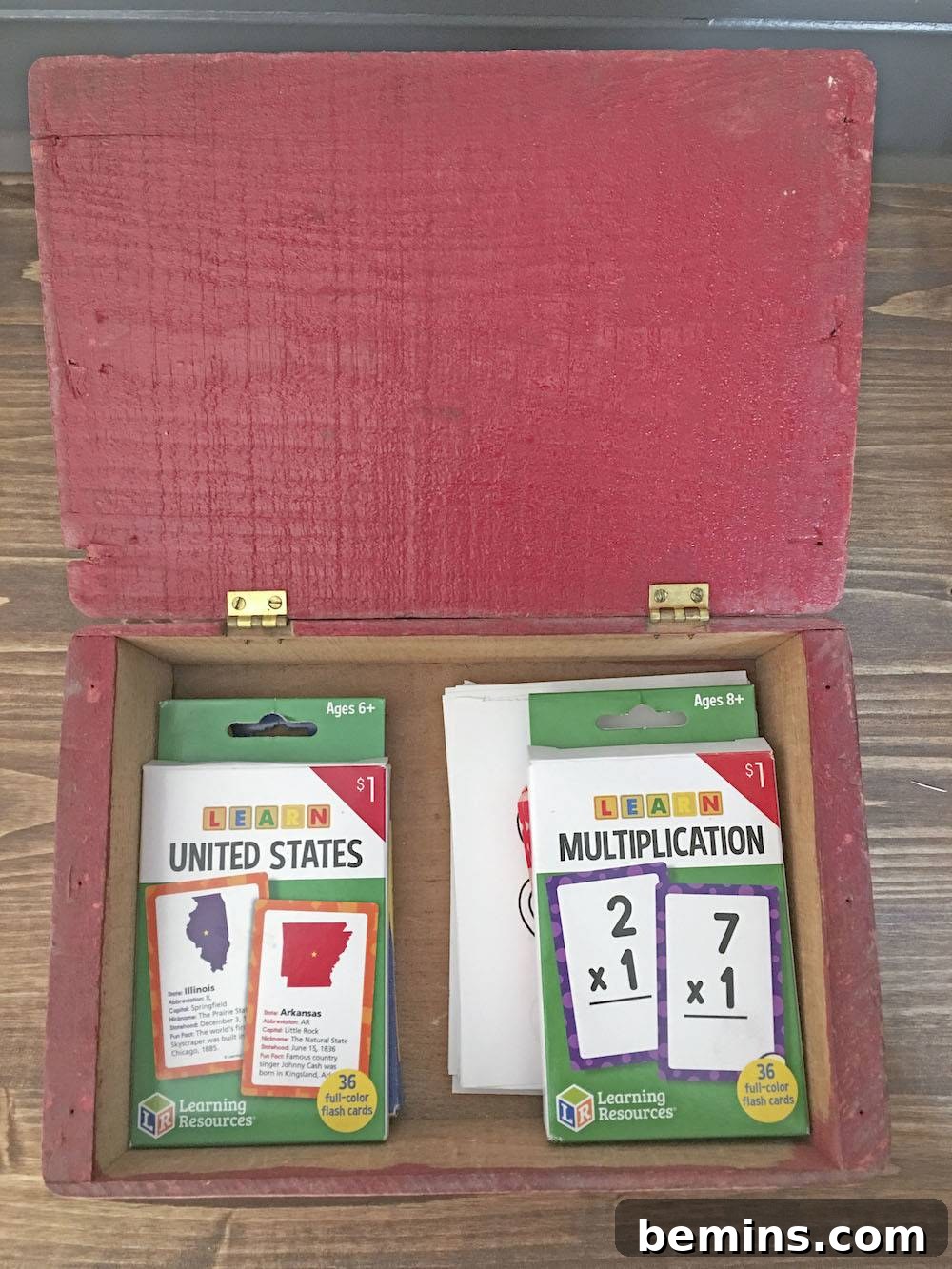 Organizing school supplies in containers.