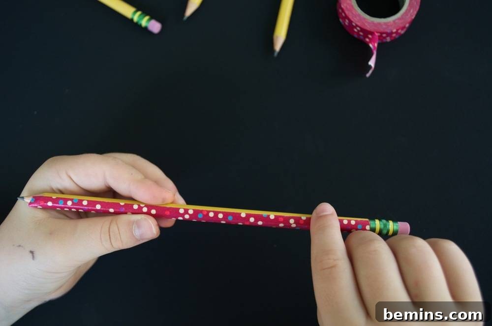 Kid-Friendly DIY: Personalized Pencil Pouches for School 8 A person doing crafts with colored pencil erasers and designer tapes: Creating personalized pencils