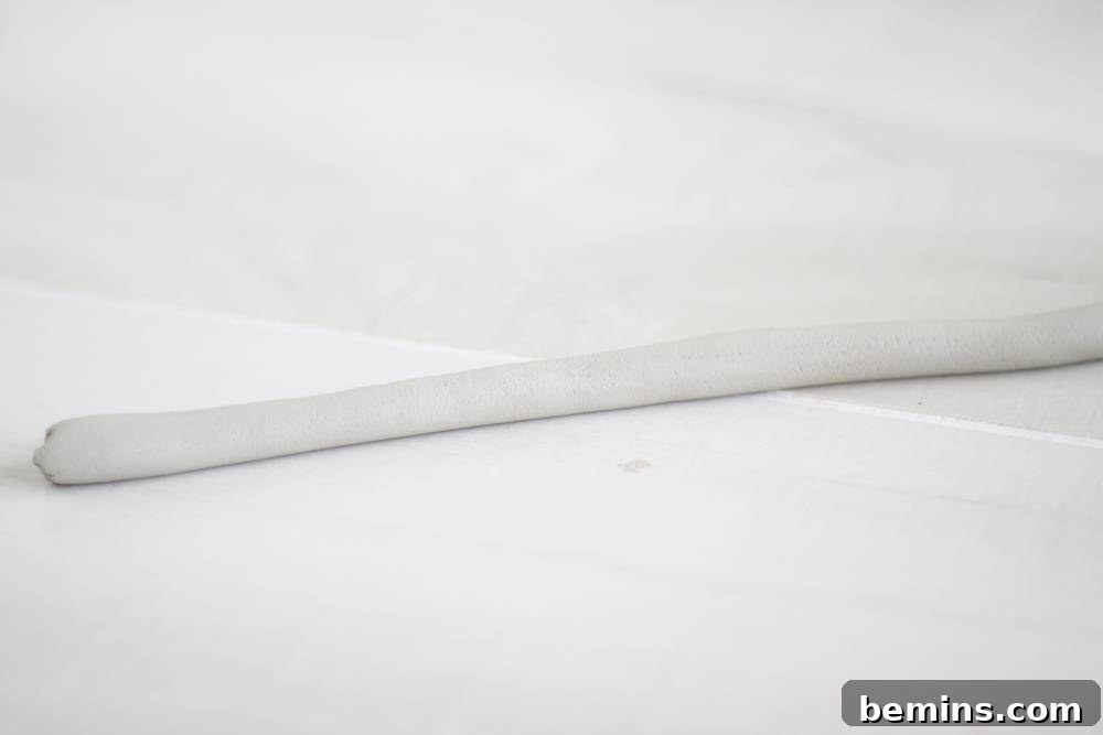 Curiosity Planter: Crafting a Quirky DIY "Bone" Vase 4 Roll a chunk of the clay to be 1/4 inch thick